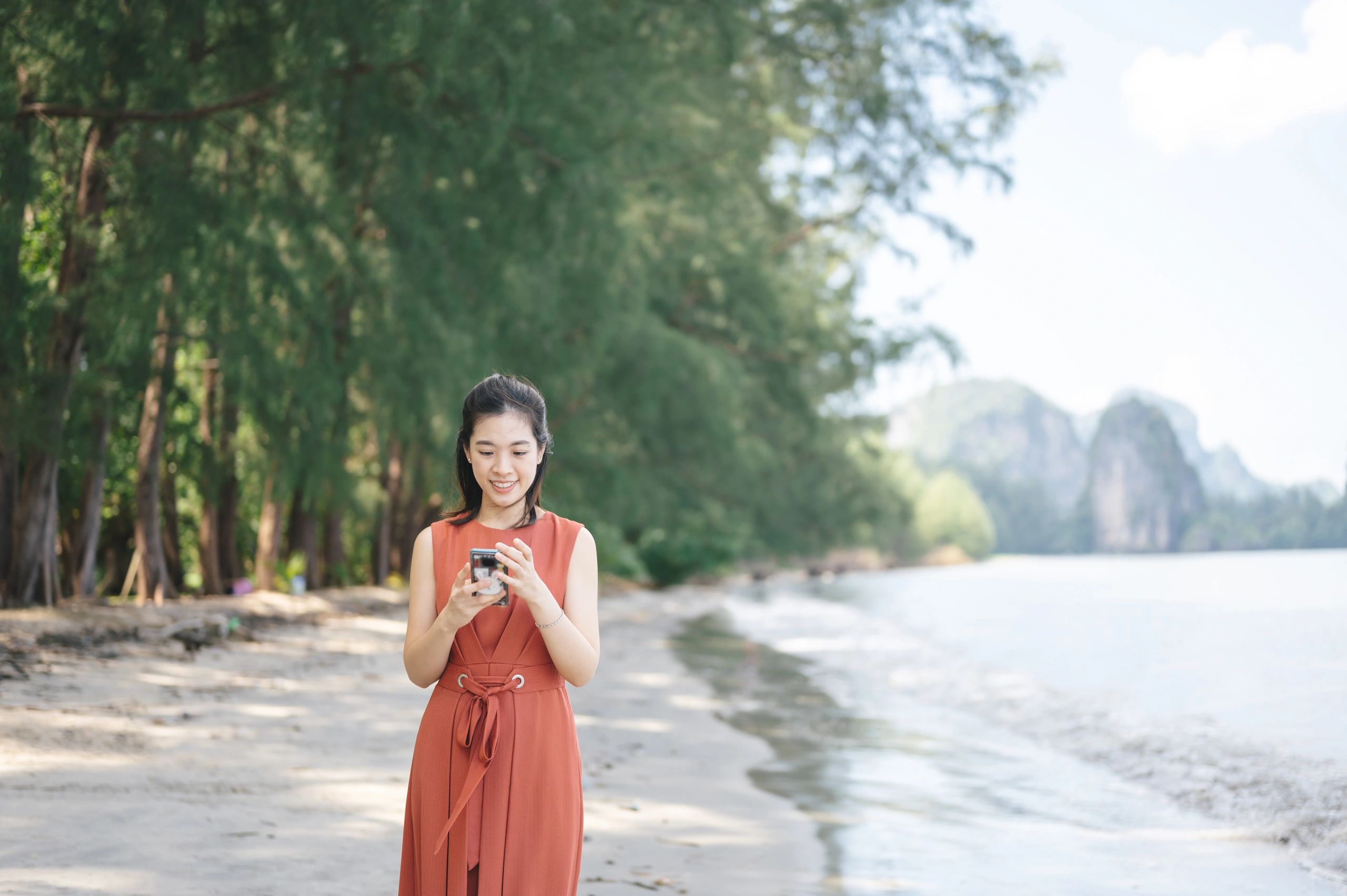 Traveler enjoying sunrise on a tropical beach