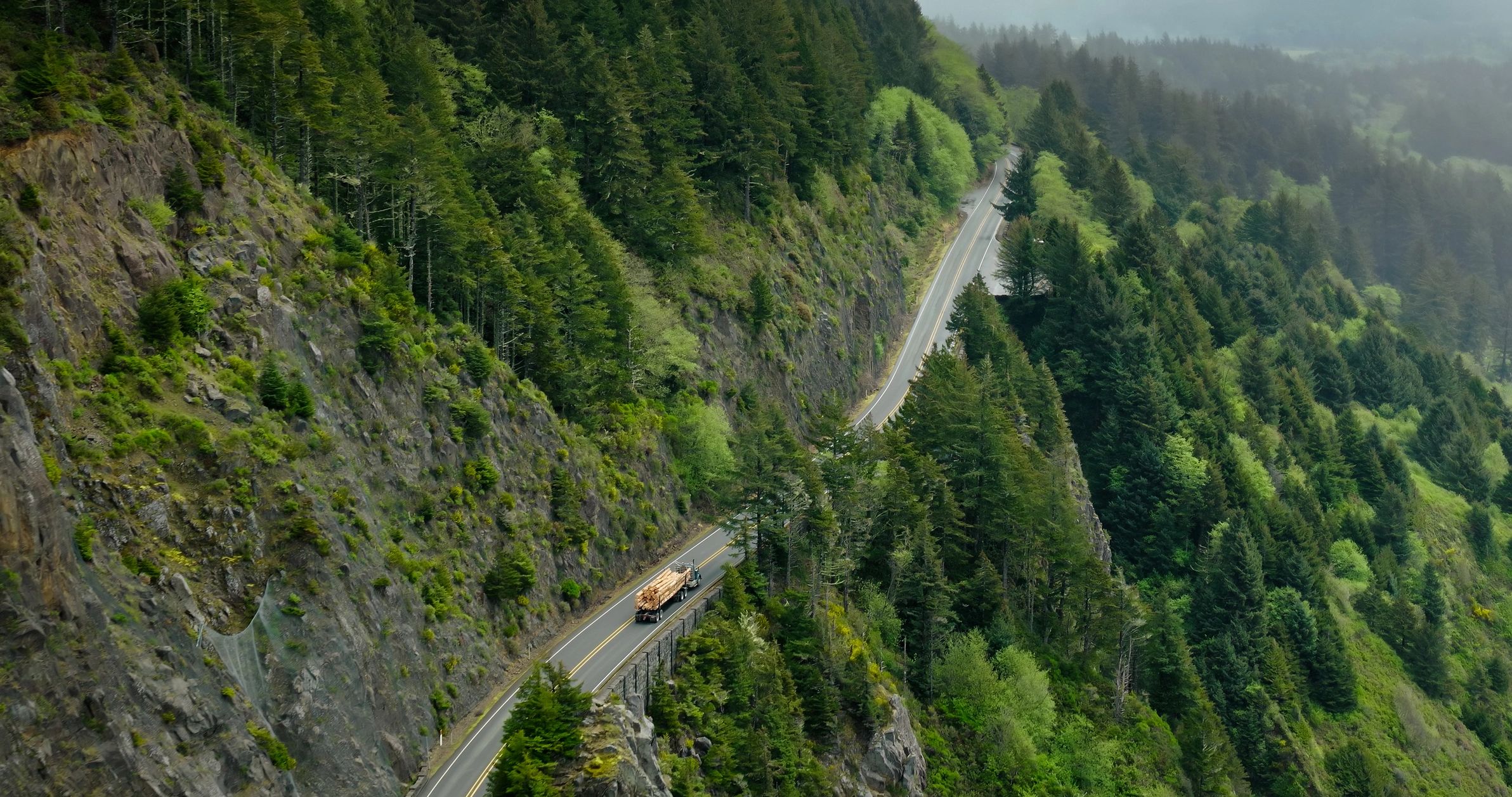 Coastal road and landscape representing open-ended travel