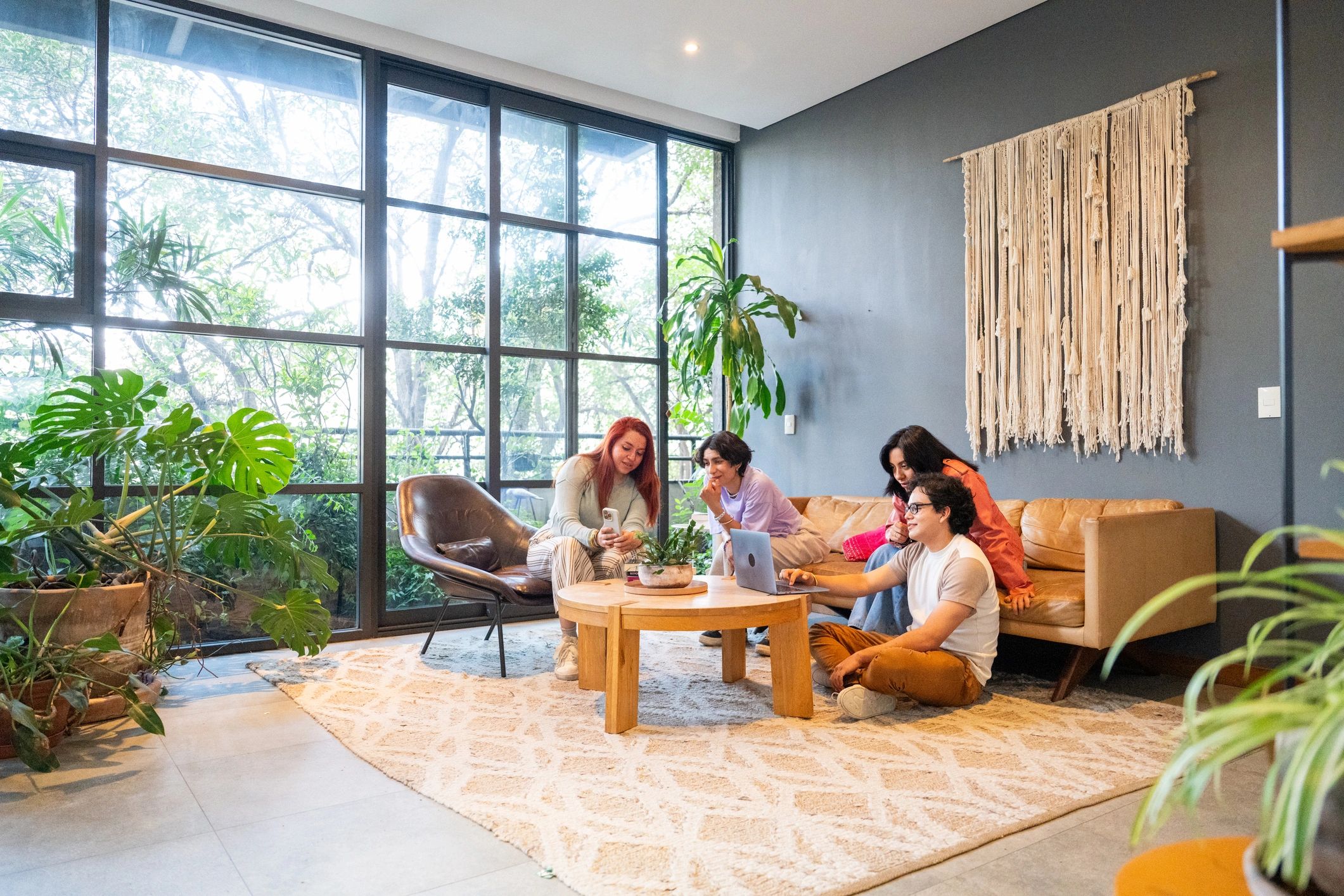Friends relaxing together in a modern apartment lounge